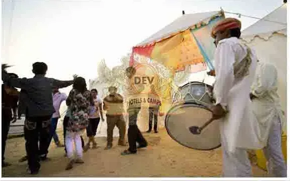 Drummers leading guests in dance