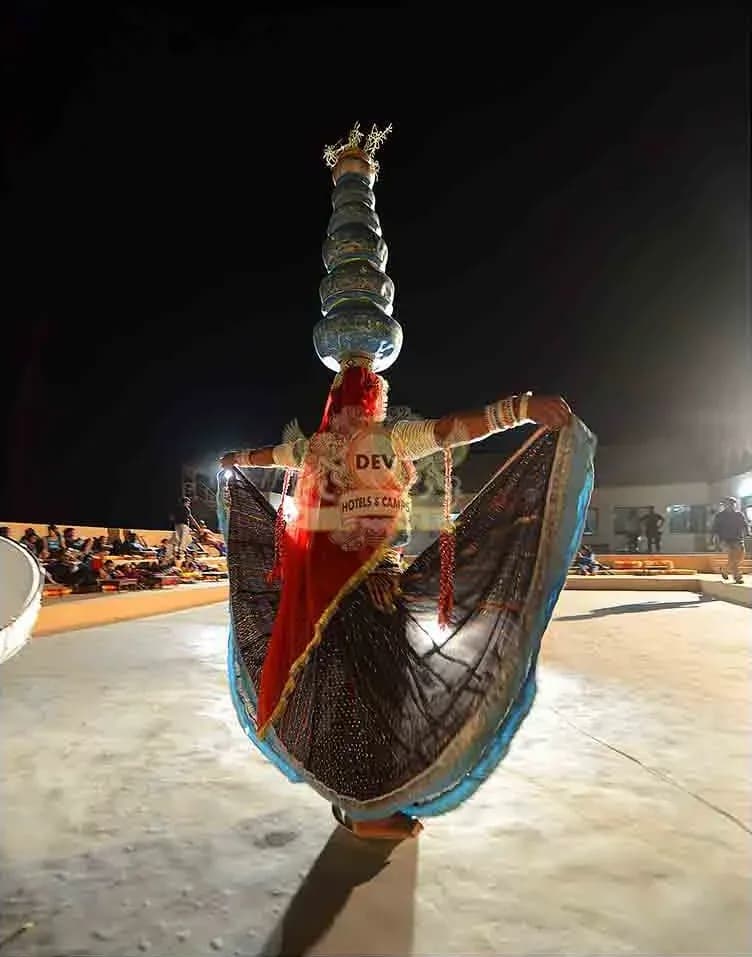 Dancer balancing a tower of pots