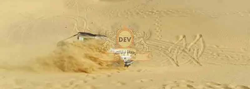 Jeep tracks across a dune