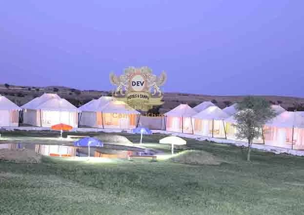 Tents and umbrellas at dusk