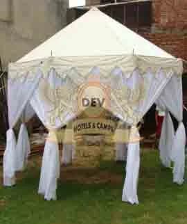 Hexagonal pergola with white drapes