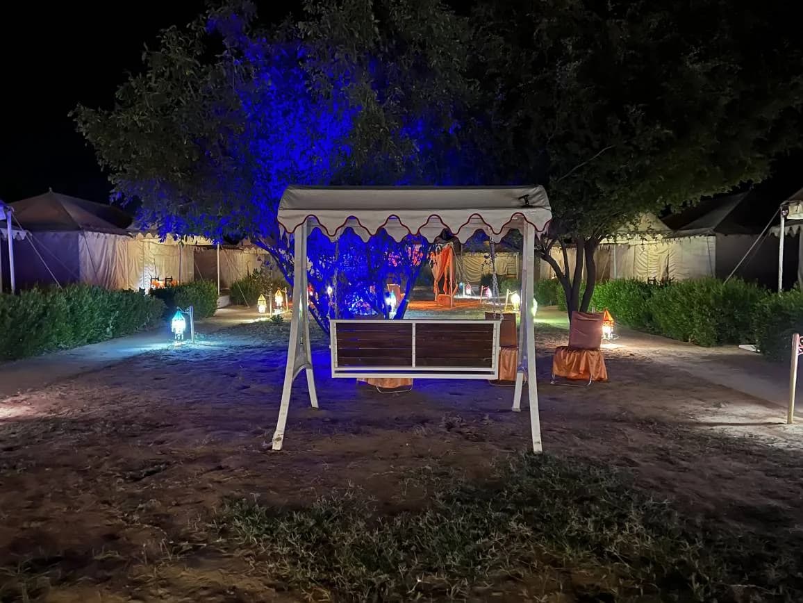 Garden swing lit at night